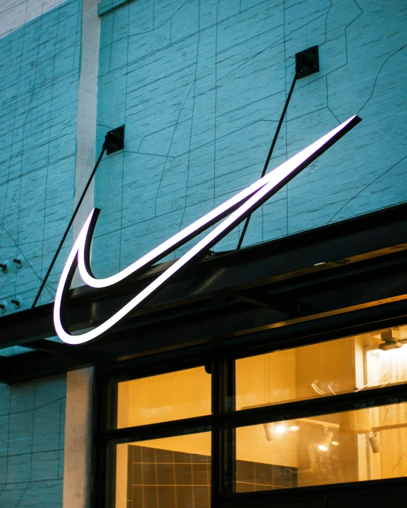 nike sign on the outside of a store front