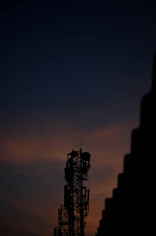 a tall tower with some radio towers on top of it