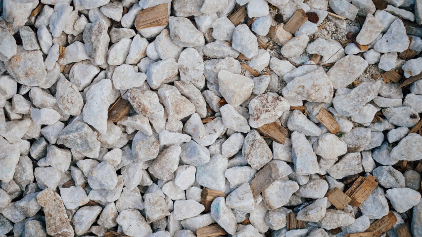 white rocks sit close to the ground in the daytime