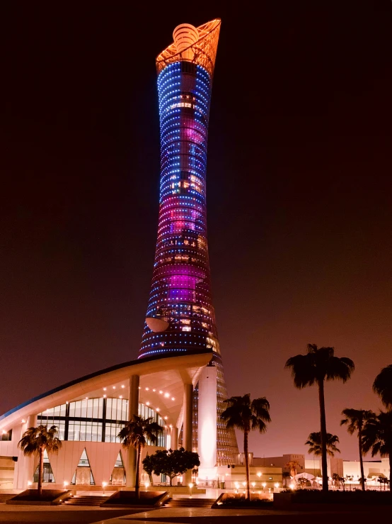 the large tower has lights on it at night