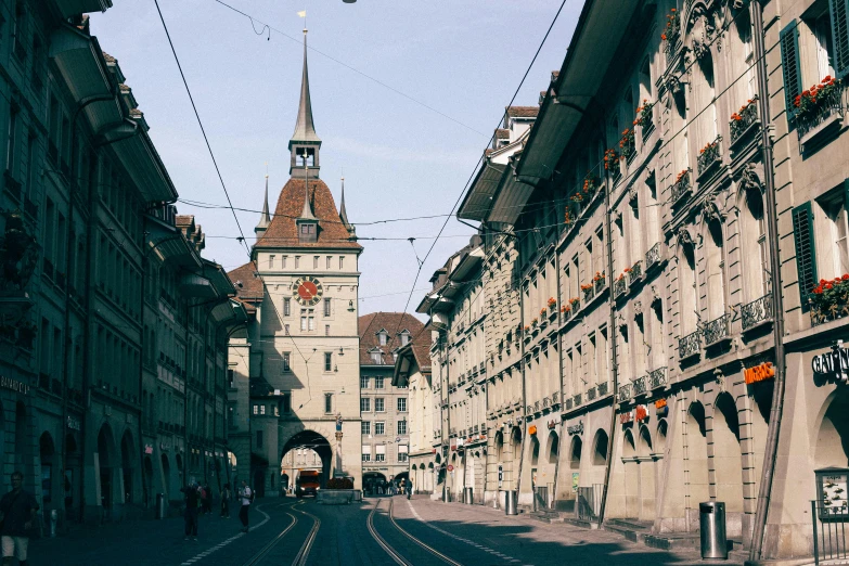 the street is lined with buildings and wires