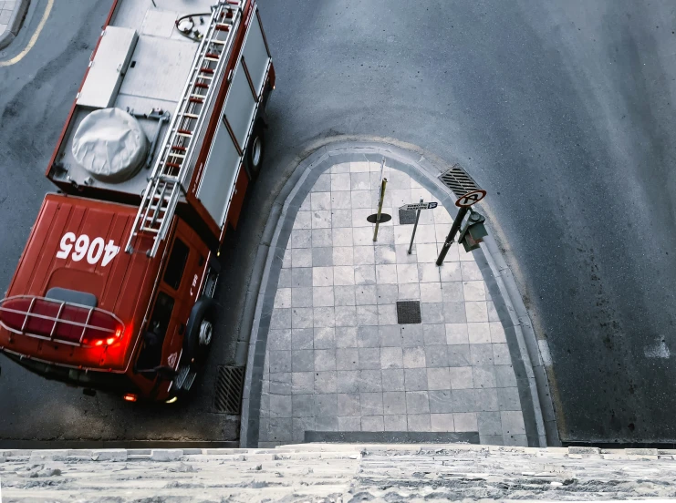 the back view of a fire truck driving down a street