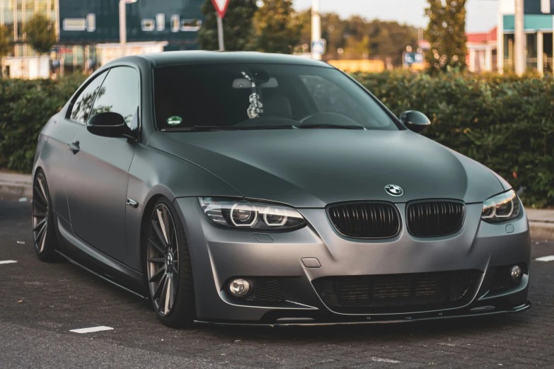 a grey car parked in a parking lot