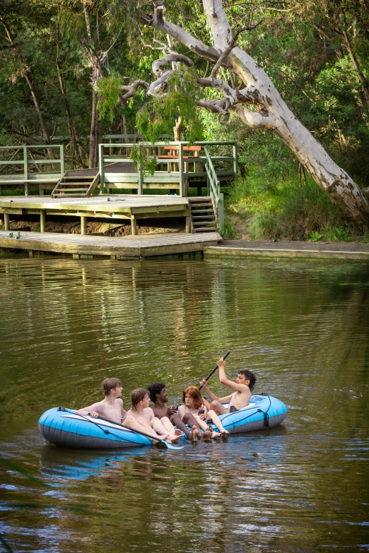 a family riding in the middle of a lake