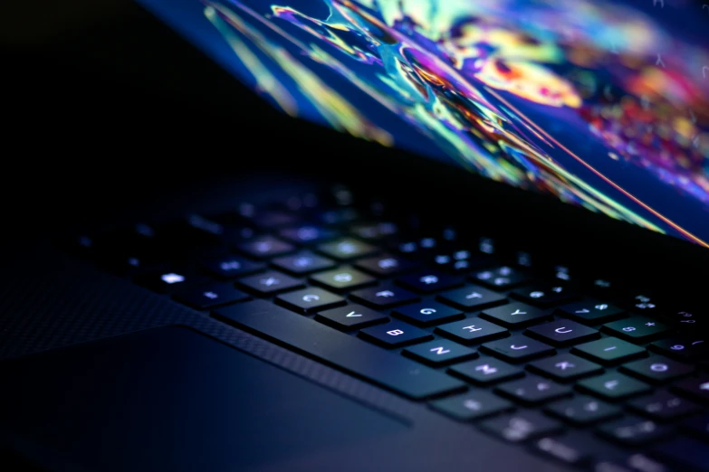 an open laptop computer sitting on top of a desk