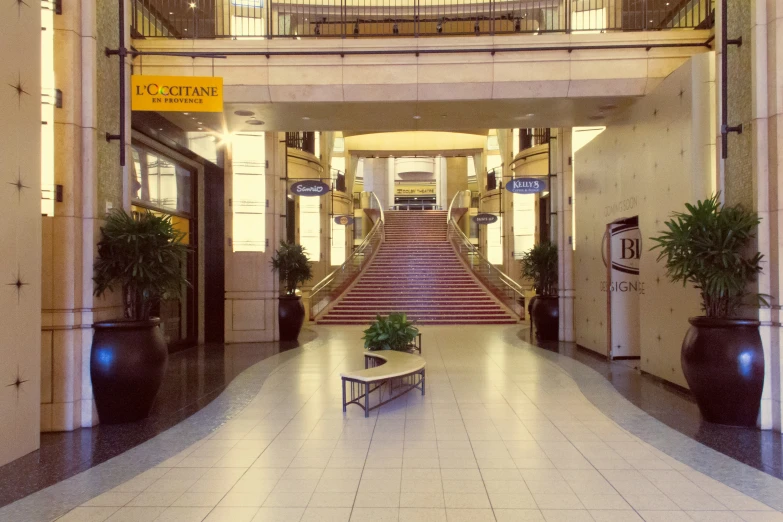 the stairs lead up into a el lobby