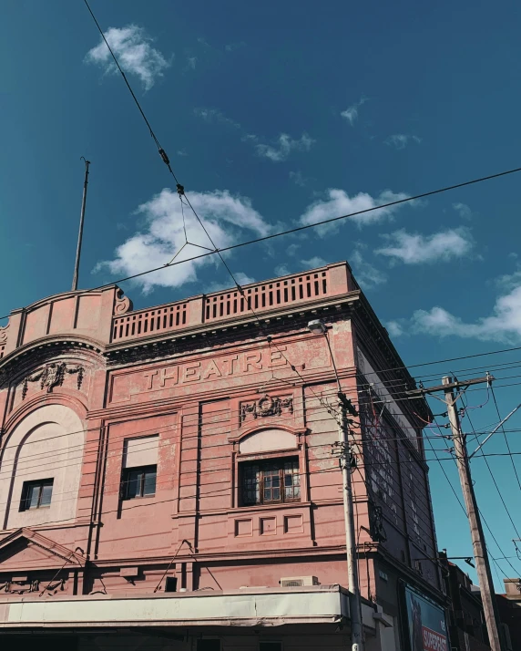 a very tall old building with many windows on top