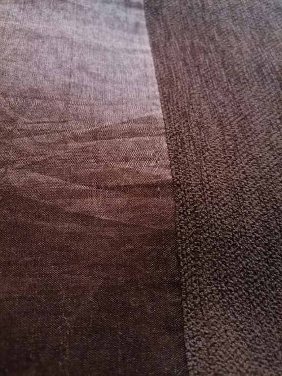 the fabric is dark brown with grey details