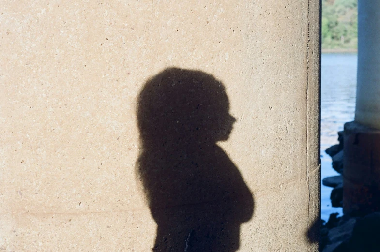 a person wearing a short skirt, and black jacket in front of a building