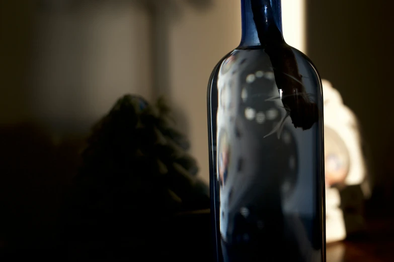 a bottle with some liquid and a clock on it