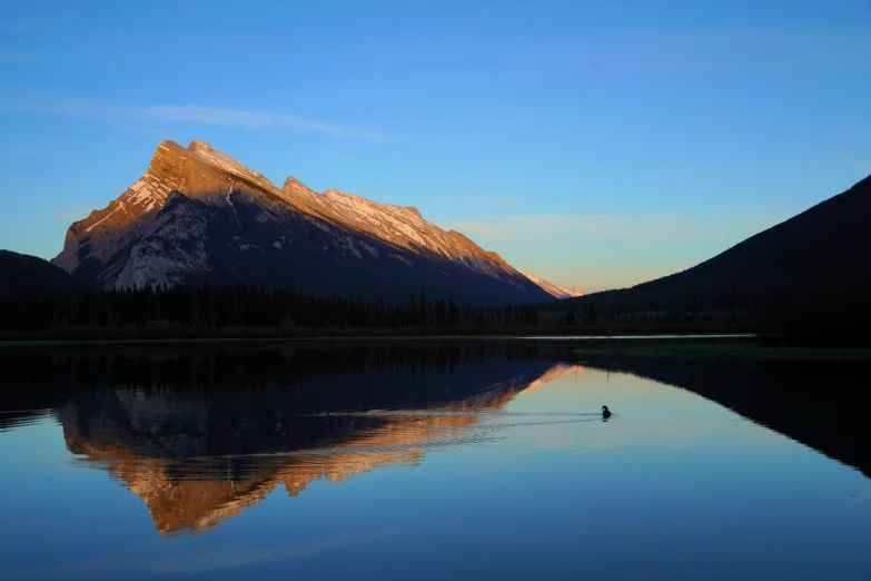 some mountains and a lake with water in it