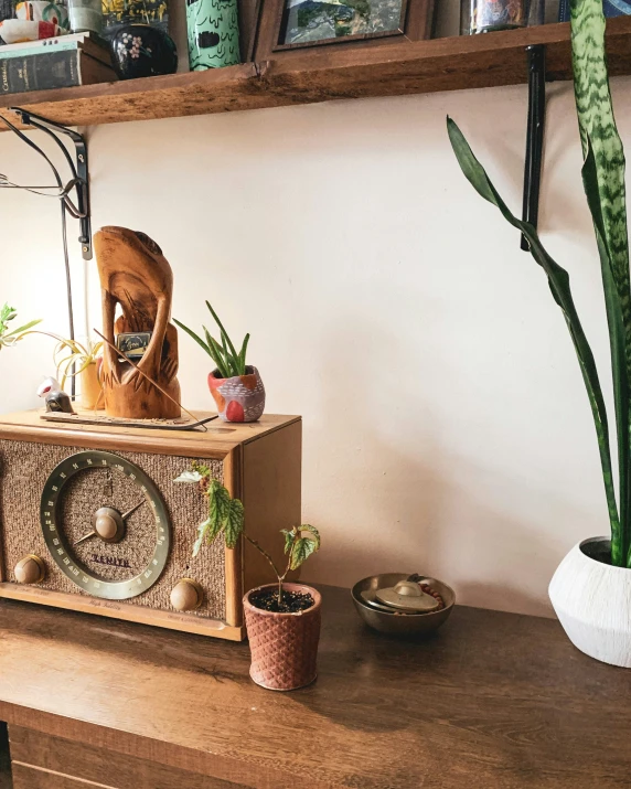 an old fashion radio sitting on top of a wooden table