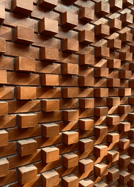 wooden blocks sitting on a wall next to each other