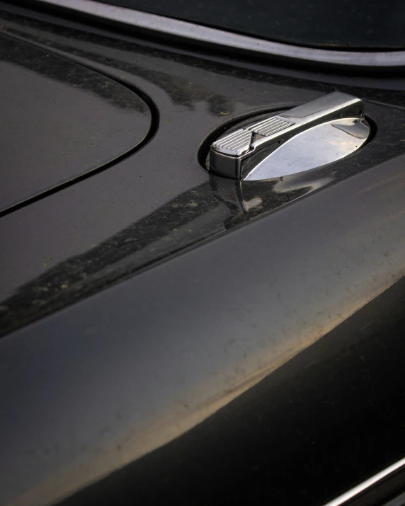 a close up of a vehicle door handle on the car