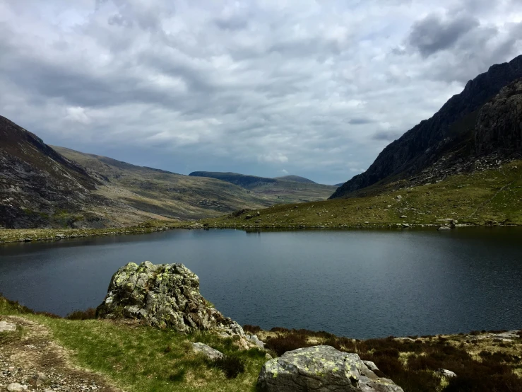 there is a mountain lake near the mountains