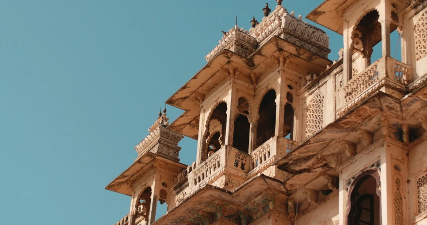 ornate old buildings stand against a clear blue sky