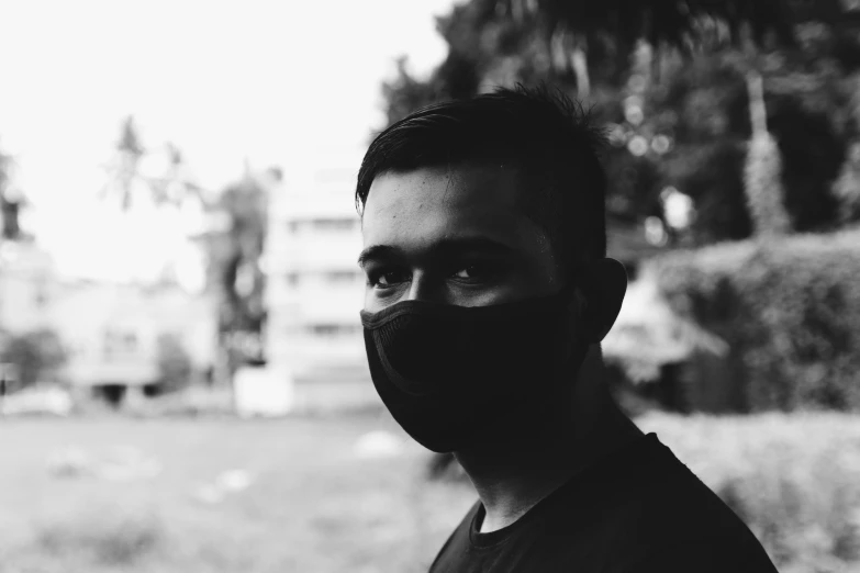 man wearing face mask on an urban street