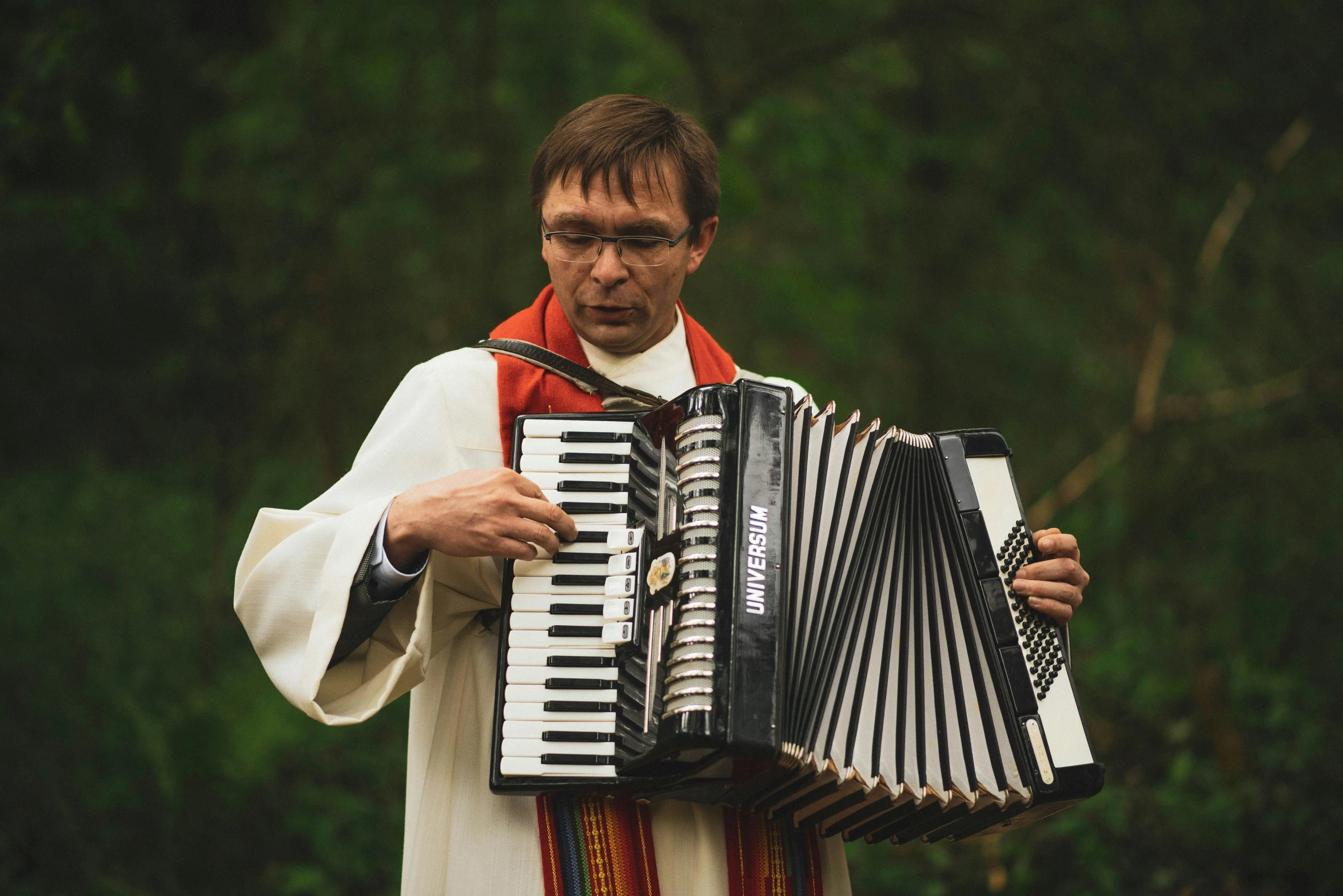 a man plays the accordion on the street