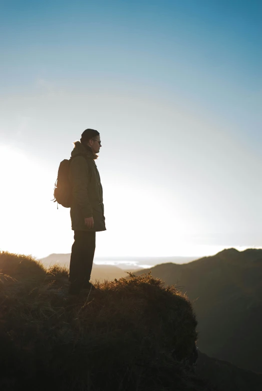 a person standing on top of a mountain