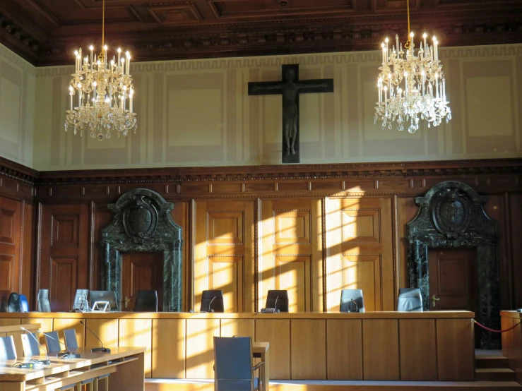 a church has been decorated with wood paneling and chandeliers