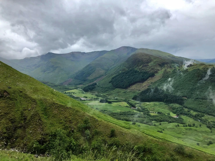 view of lush green mountains and valleys below