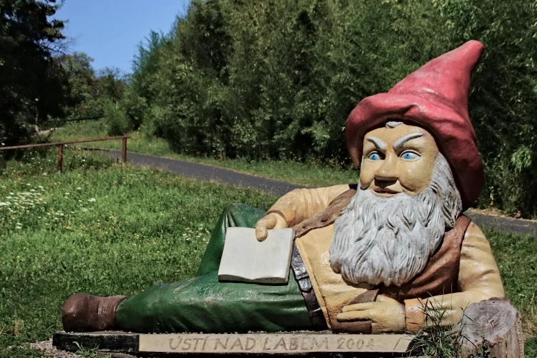 a gnome statue on the side of the road