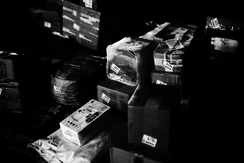 many boxes on the ground in a dark room