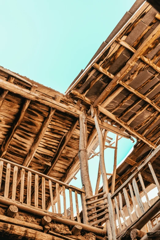 the top of a wooden structure with some stairs leading to it