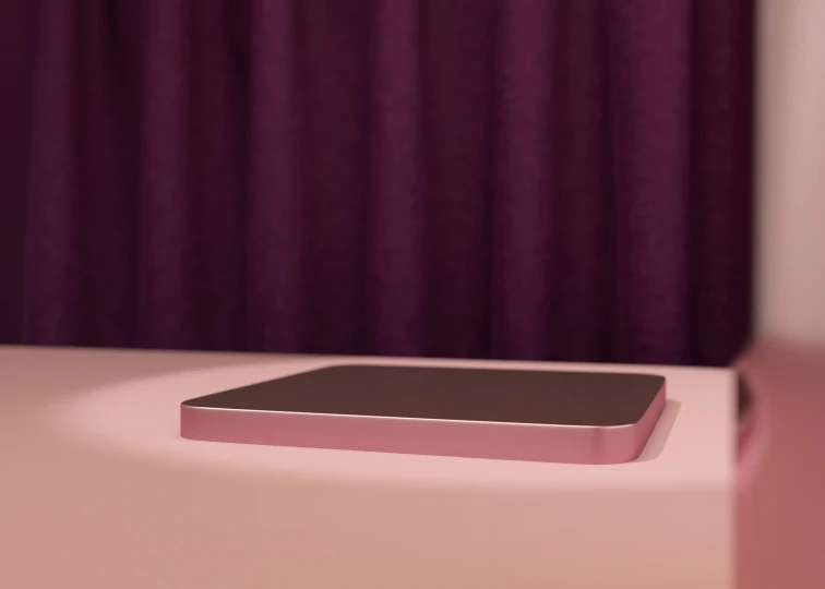 the pink box is on the counter by the curtain