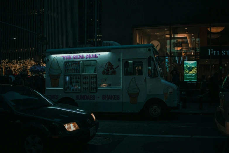 a big white food truck parked by itself in a parking lot