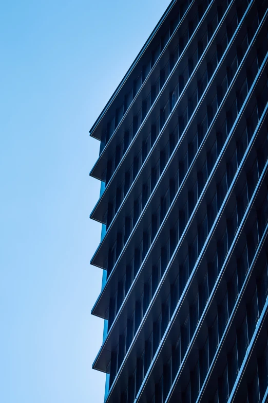 a modern looking building with a black roof