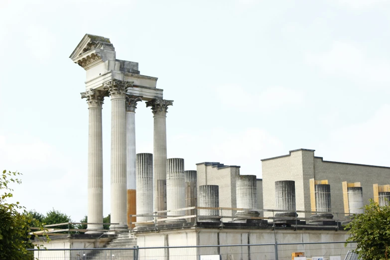 a group of roman style pillars outside a building