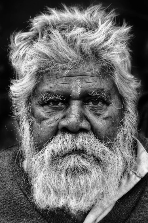 a black and white po of an old man with white hair