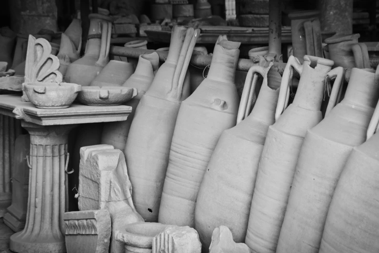 black and white pograph of old pottery on a table