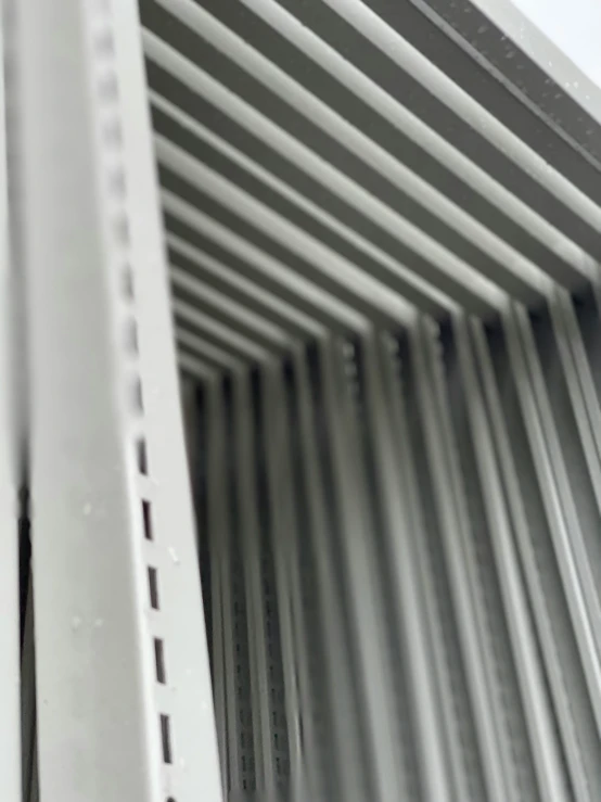 white metal posts on the side of a bridge