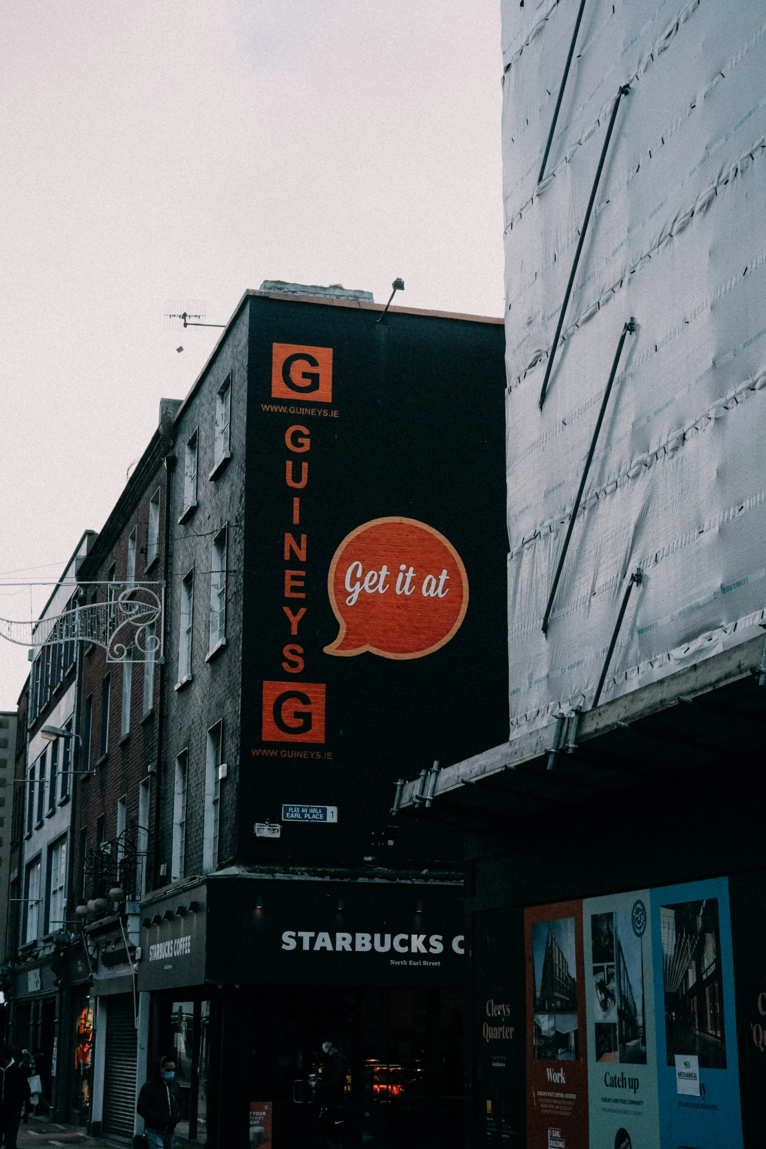 a big billboard for an eatery ad with orange bubble