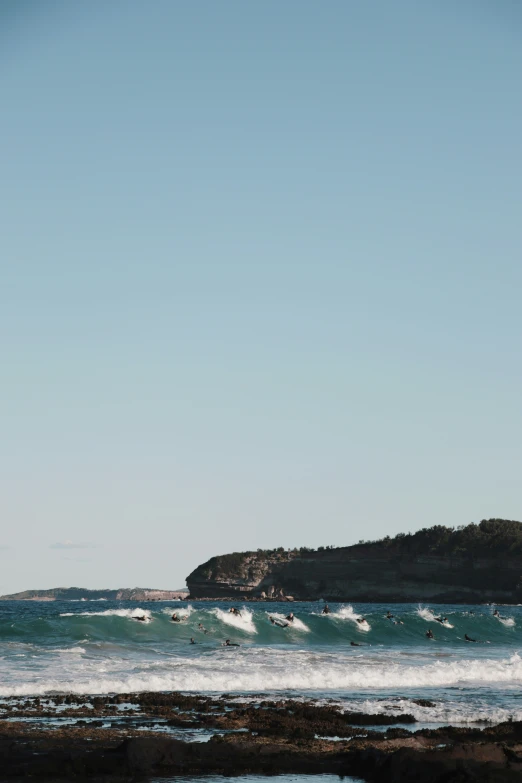 a surfer takes somersave to wave the ocean