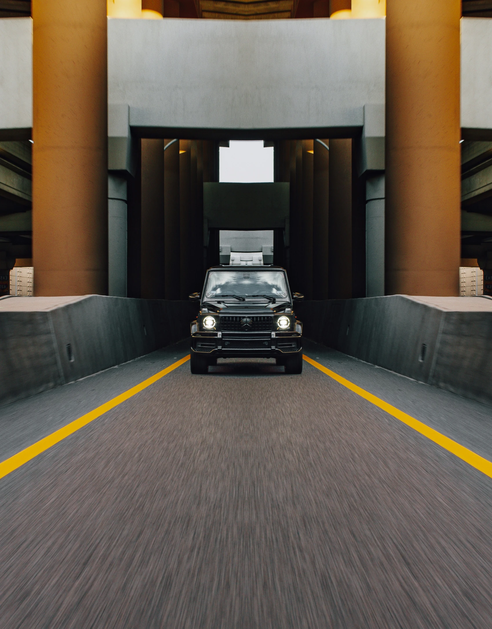 a car parked near an entrance in a parking garage