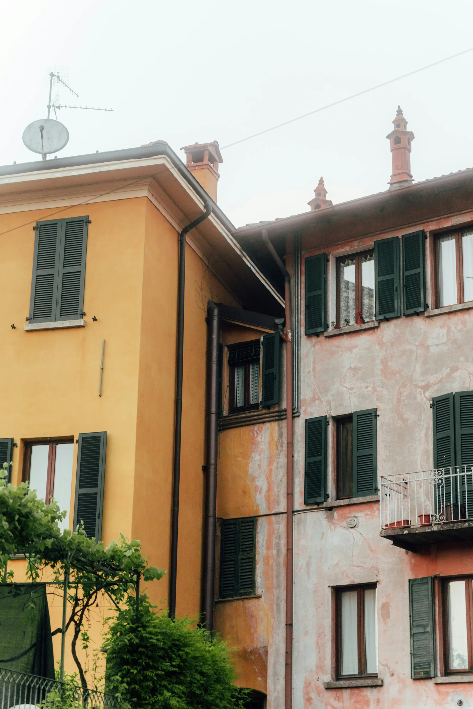 a building with some balconies on it's windows