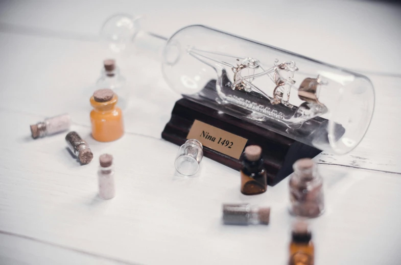 a miniature ship in a bottle with corks