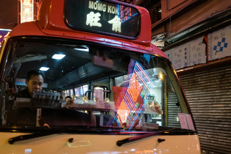 the restaurant is brightly lit with neon lights