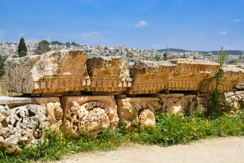 a stone structure with different designs on the side of it