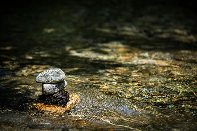 the rock are stacked on top of each other in the river