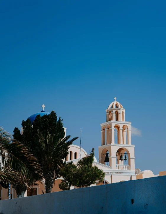 a clock tower is against a blue sky