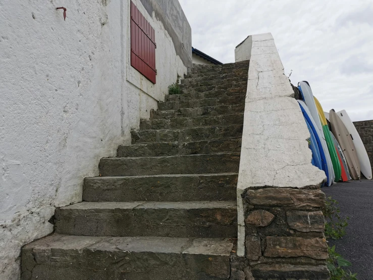 two red doors are open behind the steps