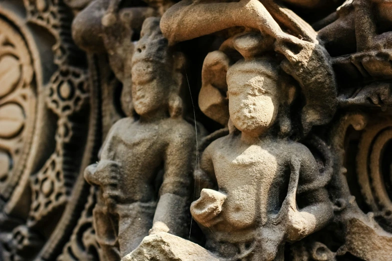 an odd design of a carving depicting children