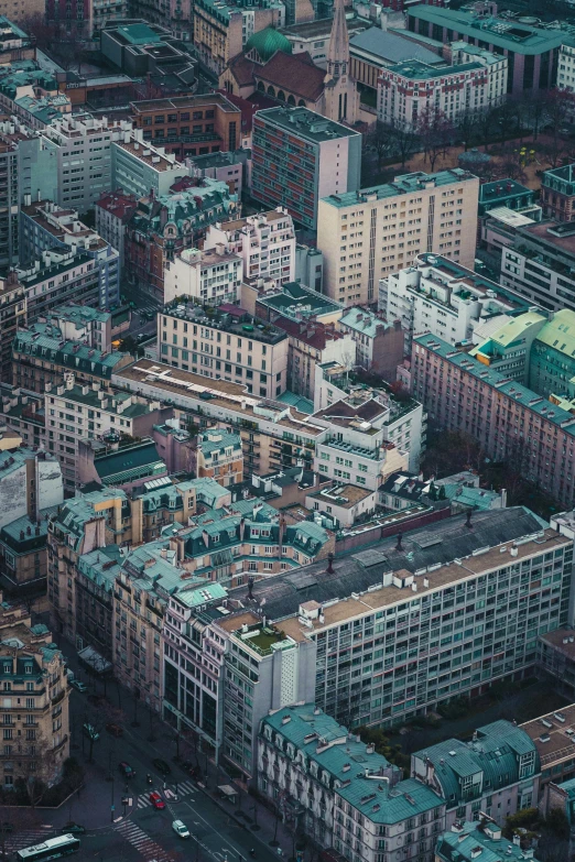 an overhead po of city buildings and lots of cars