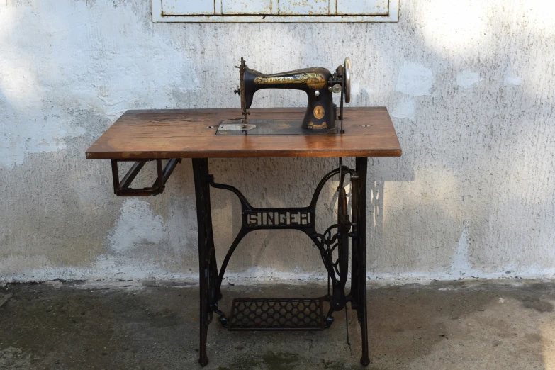 a sewing machine is on a wooden table