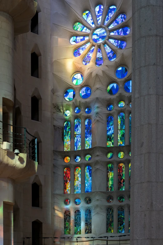 a cathedral containing a stained glass window in the center