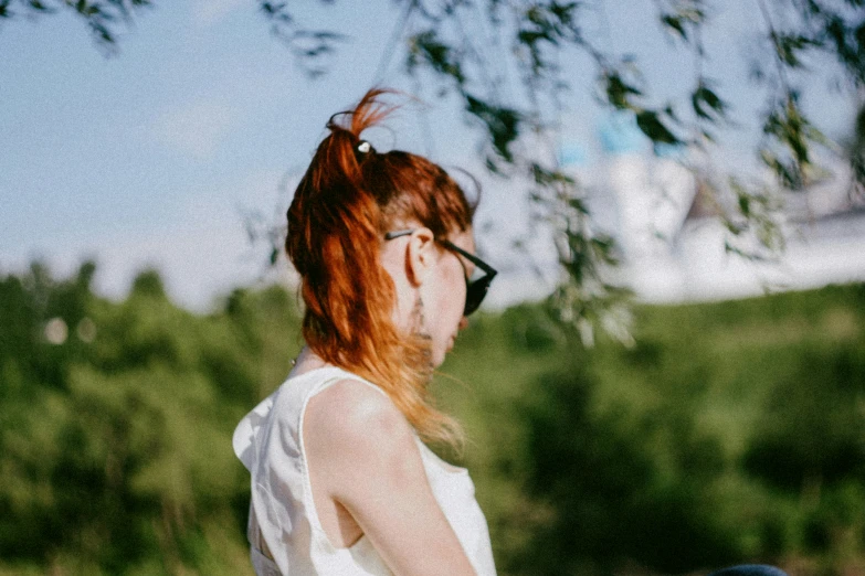 a woman holding a black frisbee in her hands